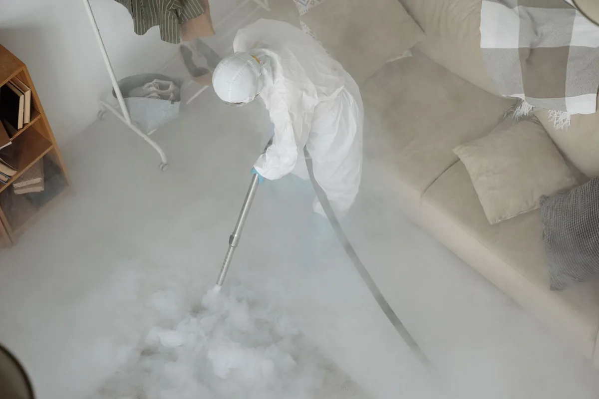 Biohazard cleanup technician in protective equipment, Spokane, WA